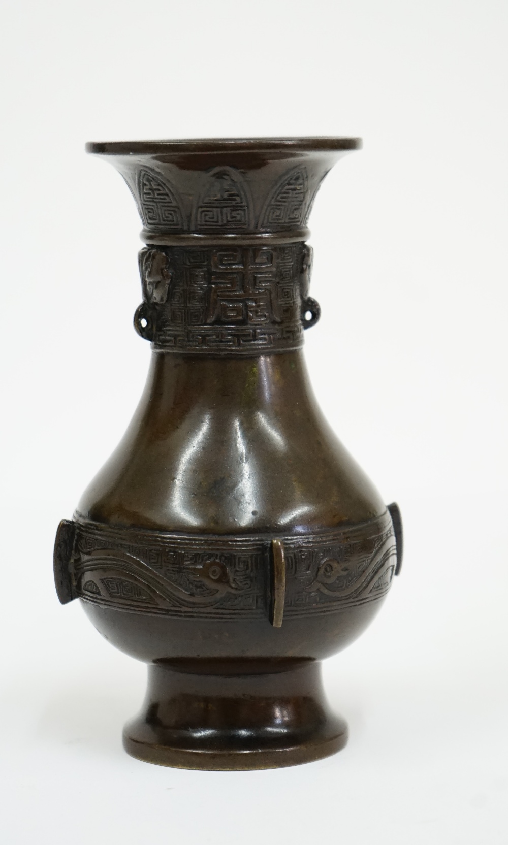 A small Chinese bronze vase, Xuande three character mark but later, of pear form, - Image 5 of 8