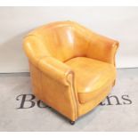 'Joris'; a tan leather tub chair with maker's stamp, 82cm wide x 74cm high.