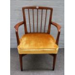 Probably Danish; a mid-20th century teak open armchair on metal capped turned supports,