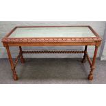 A 19th century Continental pine rectangular side table with mirror inset top on barleytwist