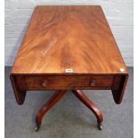 A George III mahogany ebony strung supper table, with hinged drop leaves and end drawer,