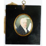 English School, early 19th Century, A portrait miniature of a gentleman wearing glasses,