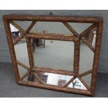 A 20th century gilt cushion framed marginal wall mirror with acanthus moulded frame,