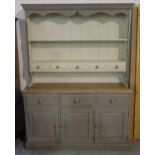 A modern grey painted pine kitchen dresser with a two tier plate rack over a three drawer cupboard