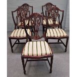 A set of twelve George III style shield back mahogany dining chairs on tapering square supports,