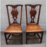 A pair of George III oak country Chippendale style dining chairs,