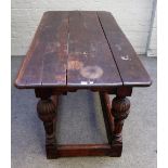 A 17th century and later oak refectory table, the triple plank top on cup and cover supports,