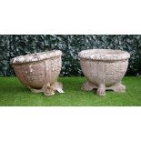A pair of reconstituted stone circular jardinieres,