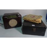 A 20th century cased gramophone, a 20th century Bush radio and a quantity of records.
