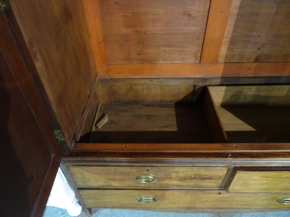 A George III mahogany linen press with moulded cupboard doors over two short and one long drawer, - Image 6 of 9