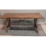 A modern Italian stained beech refectory table united by a wrought iron stretcher 180cm wide x
