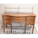 A George III style mahogany serpentine sideboard,