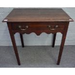 A George III oak side table, with frieze drawer and wavy apron, on moulded square legs,