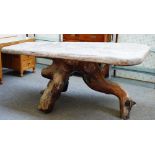 A hardwood rectangular root table, the single slap 8cm thick top on root base with trapped stone,