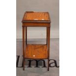 A Regency satinwood two tier occasional table on tapering square supports, 30cm wide x 68cm high.