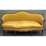 A Louis XV style tub back sofa the shape back over serpentine seat on eight shaped supports,