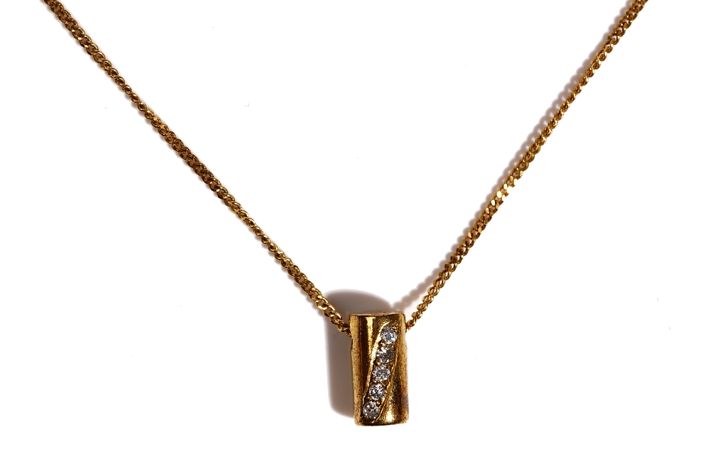 A 9ct gold and diamond set pendant, of cylindrical form,