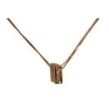 A 9ct gold and diamond set pendant, of cylindrical form,