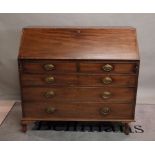 A George III mahogany bureau with two short and three long graduated drawers on bracket feet,