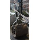 'Hickley &Co. Camberly' and early 20th century cast iron garden roller, 127cm high.