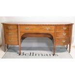 A George III style mahogany bowfront sideboard.
