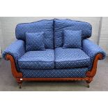 A modern Regency style two seat sofa with pattern blue diamond upholstery, 155cm wide x 94cm high.