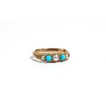 A gold ring, mounted with a row of three half pearls, alternating with two turquoise,