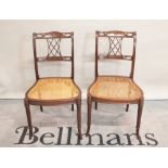 A pair of 19th century mahogany side chairs on turned outswept supports,