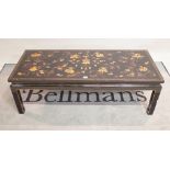 A modern black lacquer rectangular coffee table,