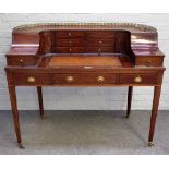A George III style inlaid mahogany Carlton House desk with three frieze drawers,
