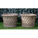 Haddonstone; A pair of reconstituted stone circular jardinieres with lattice work bodies,