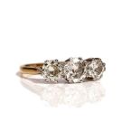 A gold and platinum, diamond set three stone ring,