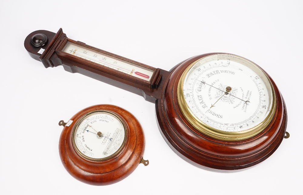 A Victorian mahogany cased wheel barometer, the white enamel dial signed D.