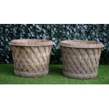 Haddonstone; A pair of reconstituted stone circular jardinieres with lattice work bodies,