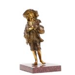 French school, a late 19th century parcel gilt bronze figure of peasant standing holding bagpipes,