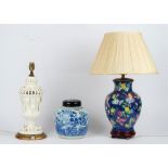 A white glazed pottery table lamp on a circular gilt painted base, 44cm high,