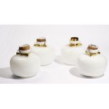 A set of four opaque glass and brass mounted pendant ceiling lights, 28cm diameter.