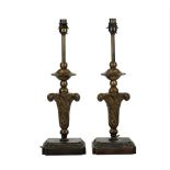A pair of 19th century table lamps, each as an upright foliate finial, 47cm high,