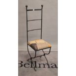 After Charles Mackintosh, a modern wrought iron highback chair, 36cm wide x 123cm high.