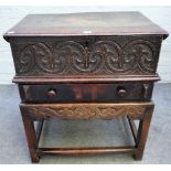 An oak bible box, 17th century, the hinged top with chip carved edge,