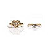 A gold and diamond set heart shaped cluster ring, mounted with a princess cut diamond,