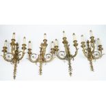 A set of four gilt-bronze three branch wall lights, of Louis XVI style,