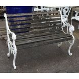 A modern white painted metal and hardwood slatted garden bench with lion mask decorated arms,