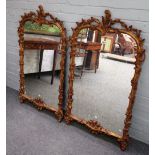 A pair of mid-19th century gilt framed arch top mirrors, with foliate chased frames,