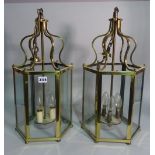 A pair of early 20th century brass octagonal hanging lanterns, 53cm high (2).