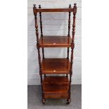 A Victorian rosewood four tier whatnot with single drawer base, on turned supports,