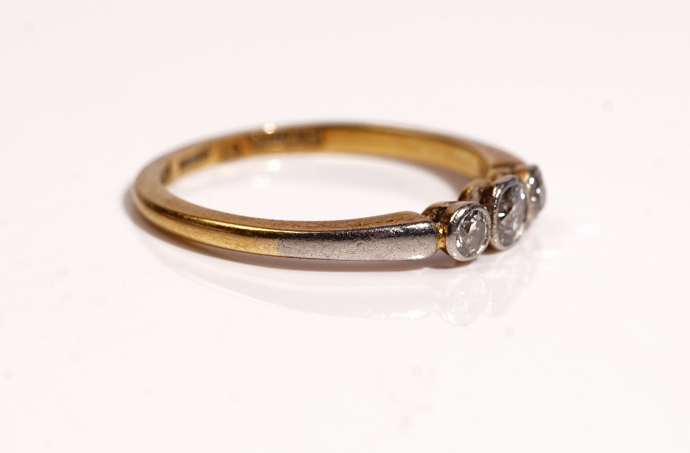 A gold and platinum, diamond set three stone ring, - Image 2 of 2