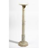 A white and grey onyx pedestal, 20th century, 21cm wide x 96cm high.