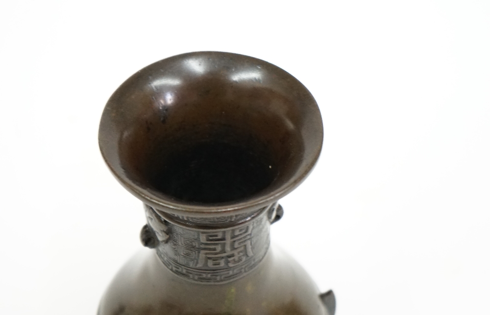 A small Chinese bronze vase, Xuande three character mark but later, of pear form, - Image 6 of 8