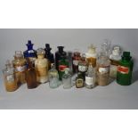 A large quantity of mostly 20th century glass apothecary jars, the largest 23cm high (qty).